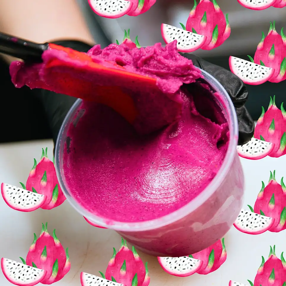Buoy Bowl with pitaya blend being put into bowl with spatula