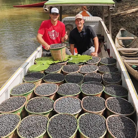 Derek & Marshall with a boat load of Açaí berries.